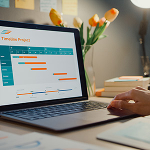 A person focused on a laptop, working on a project